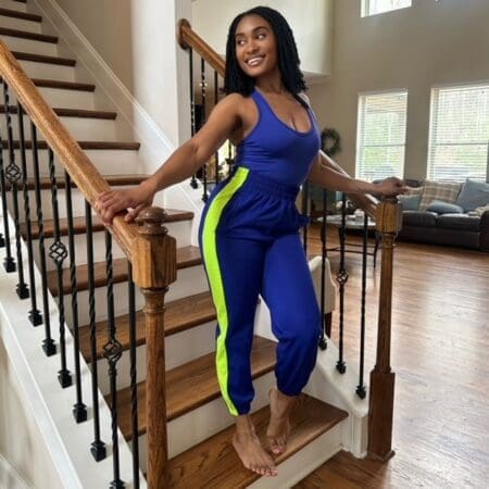 Image of Stripe Track Bottom with Matching Bodysuit - a stylish athleisure set featuring a modern side panel stripe, snug fit track pants, and a seamless, curve-accentuating bodysuit, perfect for gym, lounging, or running errands.